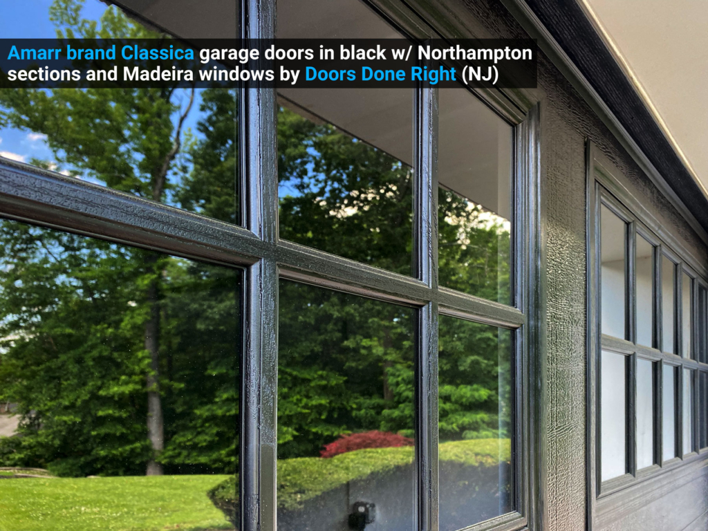 Amarr brand Classica garage doors in black w/ Northampton sections and Madeira windows grilles view