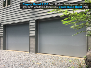clopay model 9133 flush modern steel garage door in gray with woodgrain texture