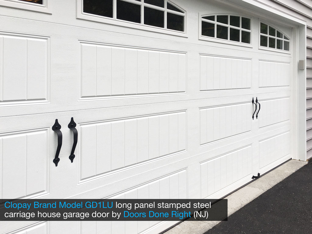 clopay brand stamped steel carriage house garage door model gd1lu with arch1 with grilles windows - panel closeup