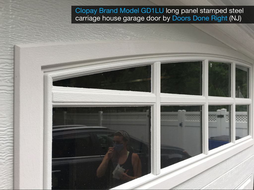 clopay brand stamped steel carriage house garage door model gd1lu with arch1 with grilles windows - window closeup