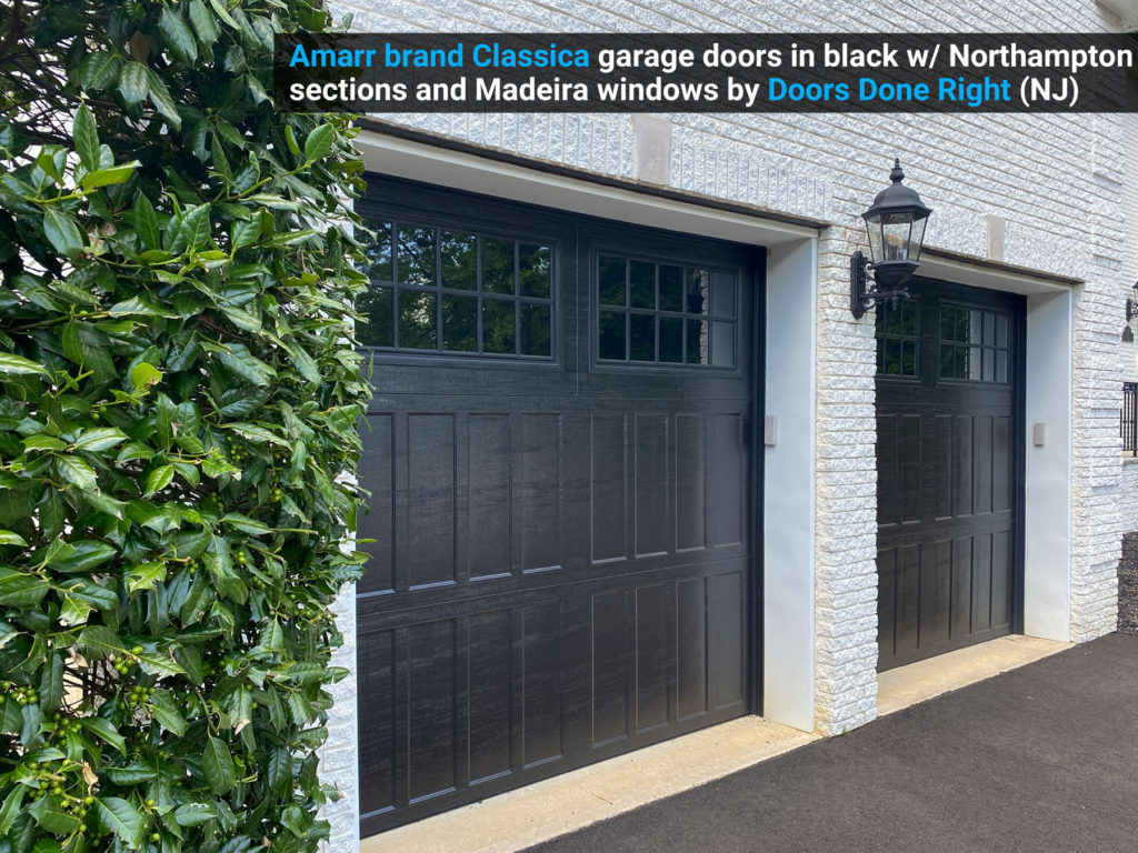 Amarr brand Classica garage doors in black w/ Northampton sections and Madeira windows angled foliage view