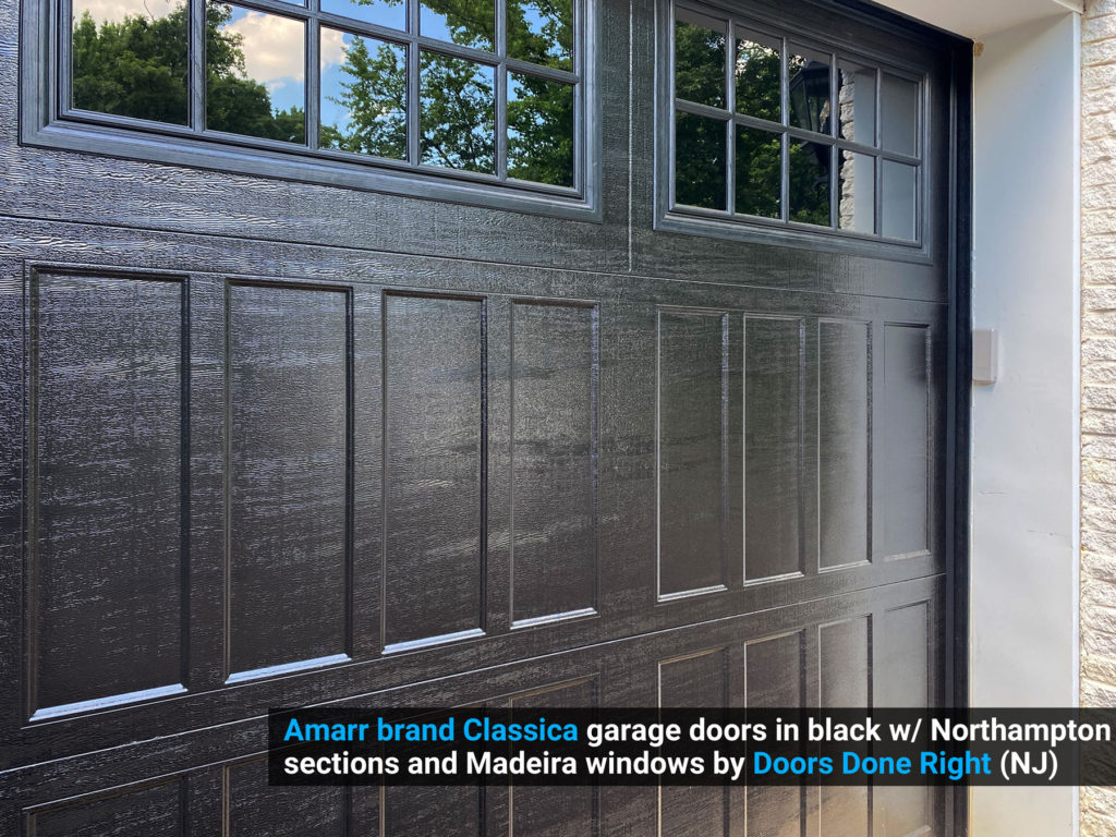 Amarr brand Classica garage doors in black w/ Northampton sections and Madeira windows closeup